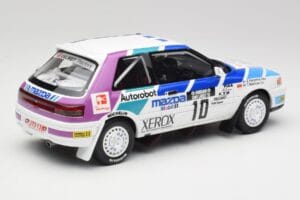 Mazda 323 GTX #10 T. Makinen / S. Harjanne 1000 Lakes Rally 1991 Otto 1:18 OT1099 Hars — afbeelding 2 van 6